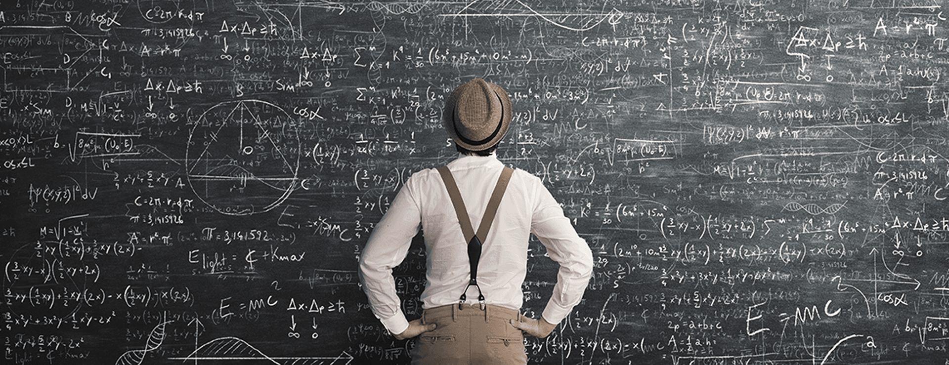 A person wearing a hat and suspenders stands facing a large blackboard covered completely in complex mathematical equations, formulas, and diagrams, appearing deep in thought.